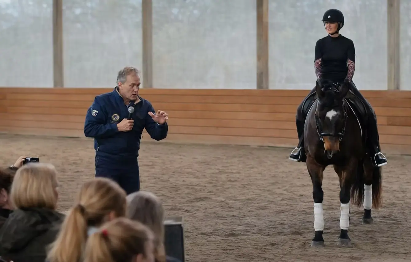 Clinician teaching a mounted rider during a Seven Hills dressage clinic
